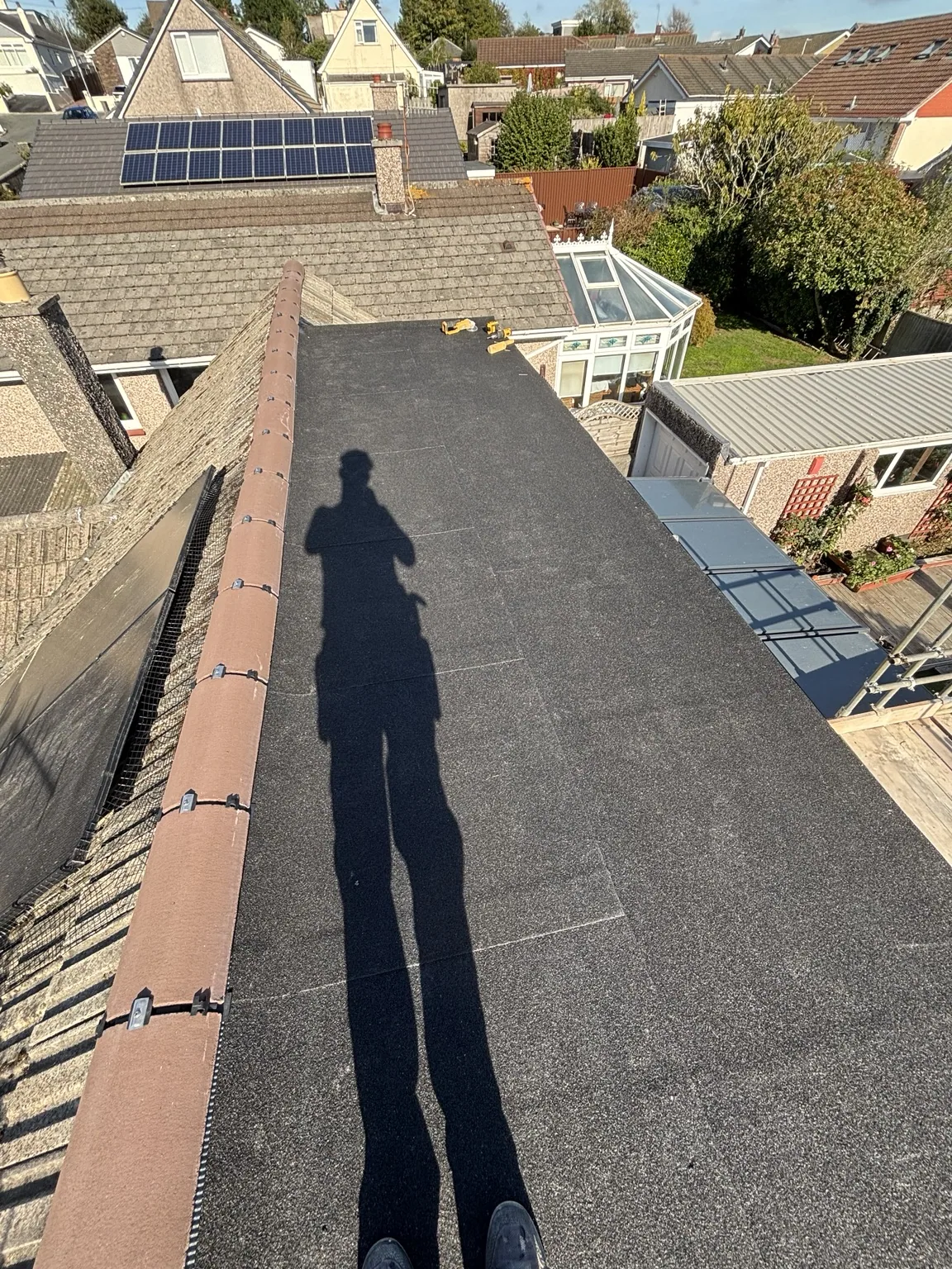 Finished torch-on felt roof surface