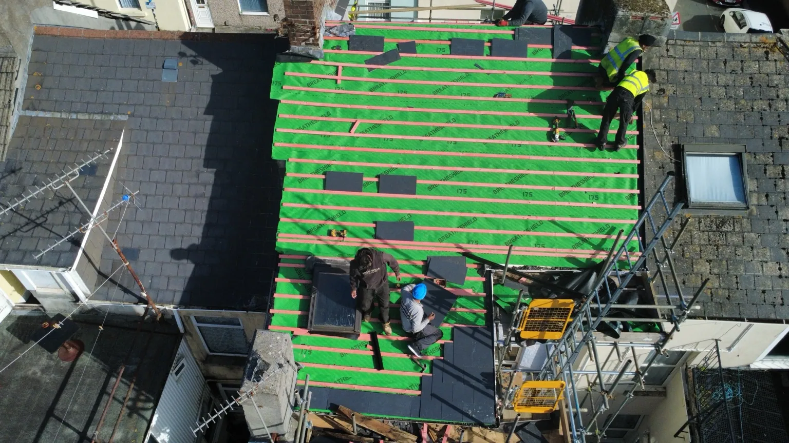Roof membrane and battens exposed during a Plymouth roofing project