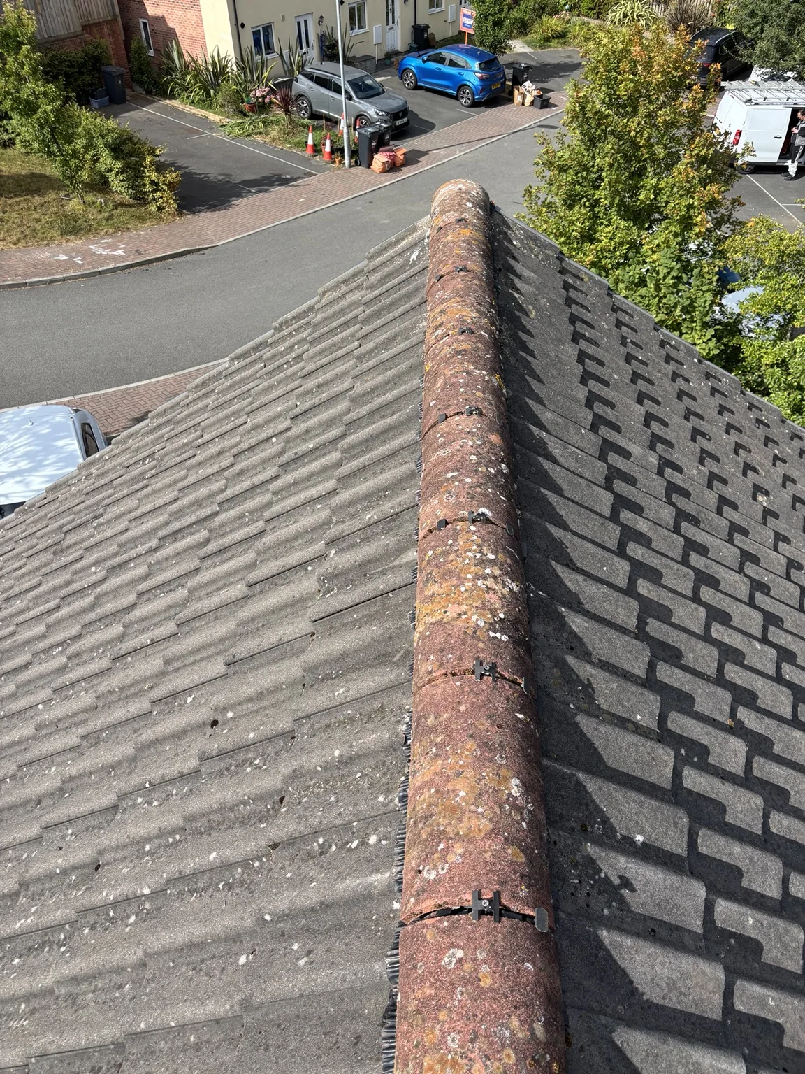 Existing ridge tiles before dry ridge work by Shield Roofing