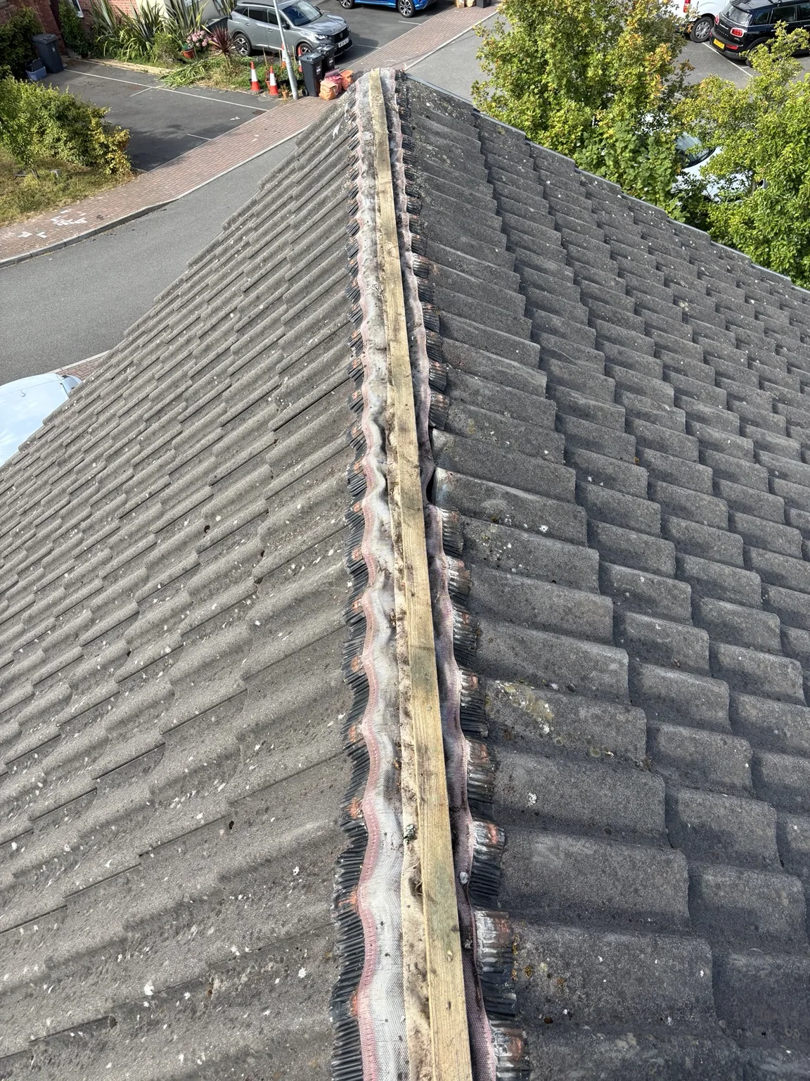 Ridge line prepared for dry ridge installation by Shield Roofing