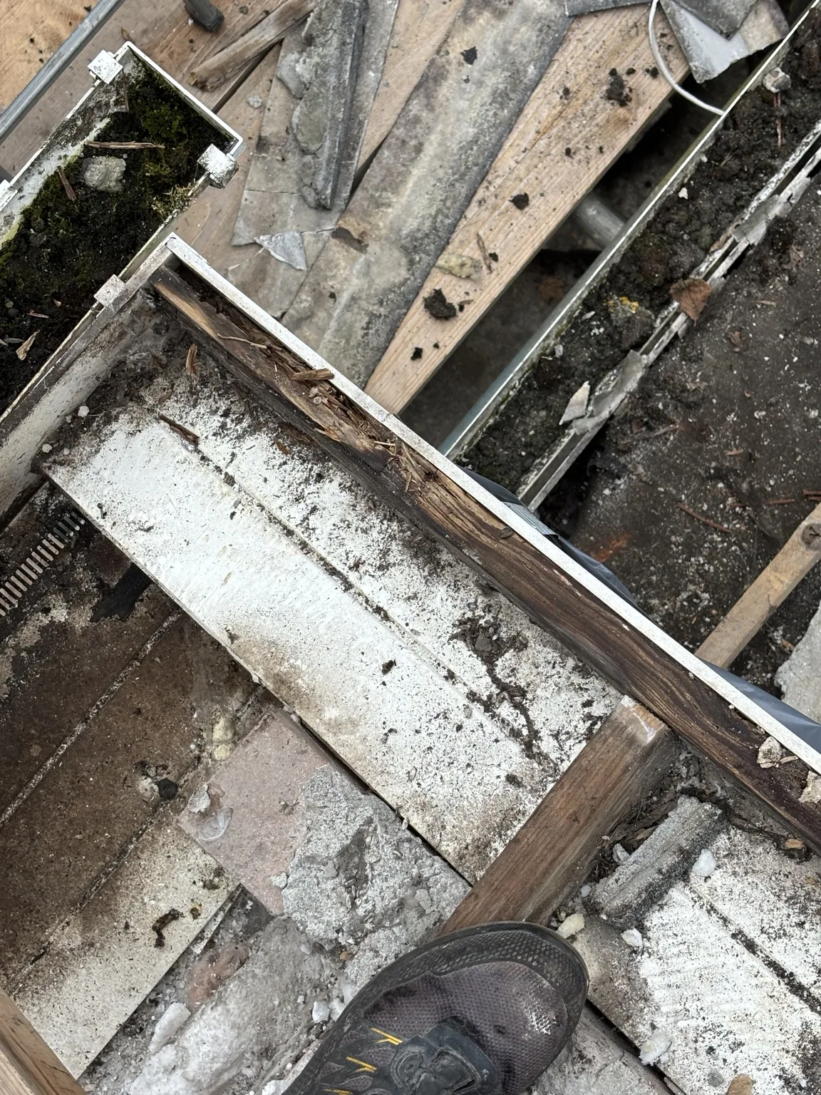 Exposed roof timber and old roof materials during Shield Roofing re-roof